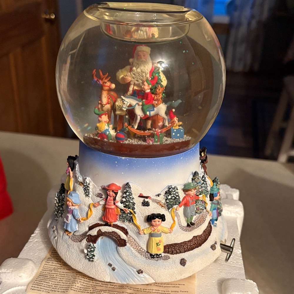 PartyLite Multi-Color Santa Carousel Snow Globe with Festive Village Base